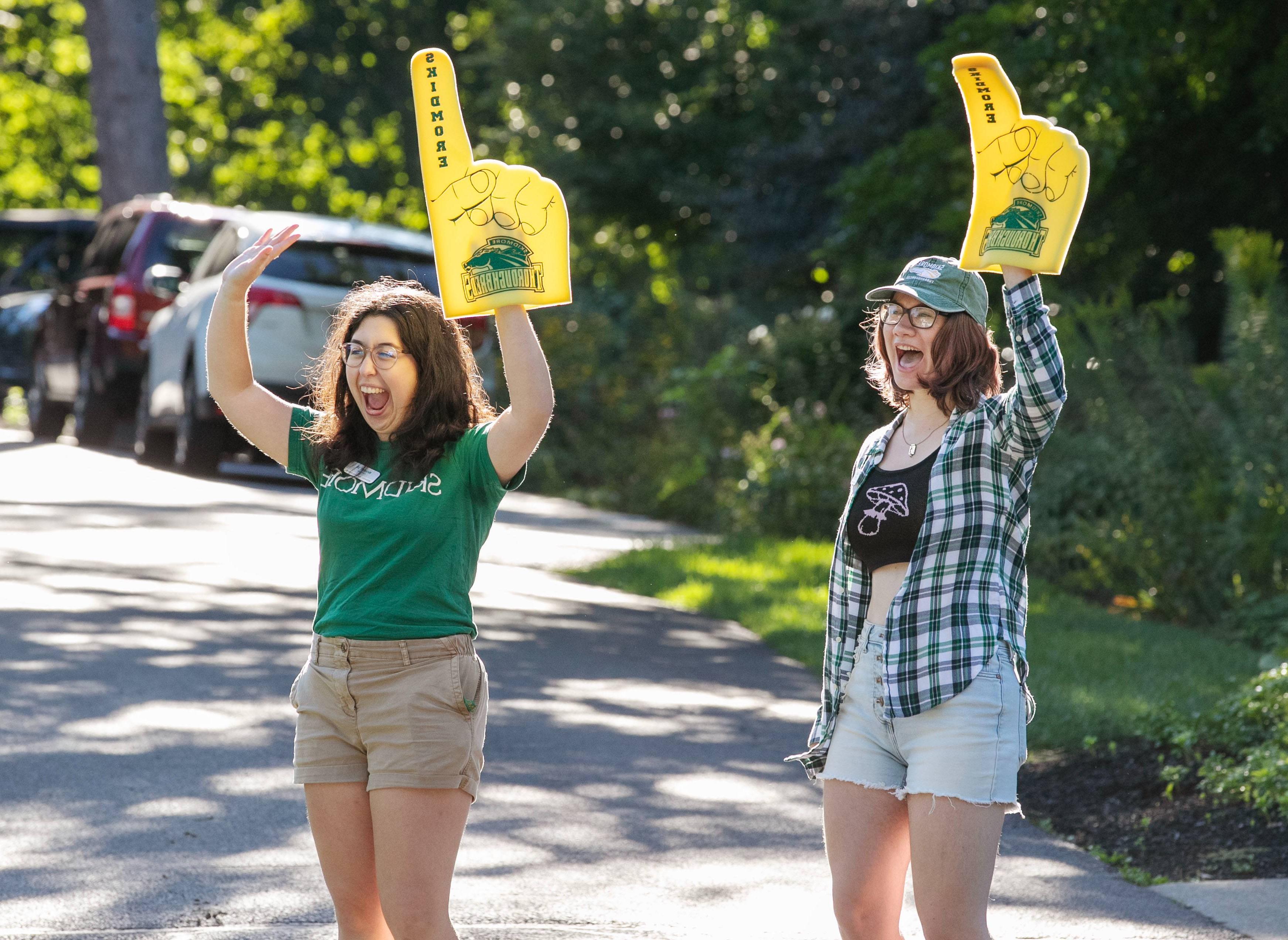 Students joyfully welcome first-year students to campus.